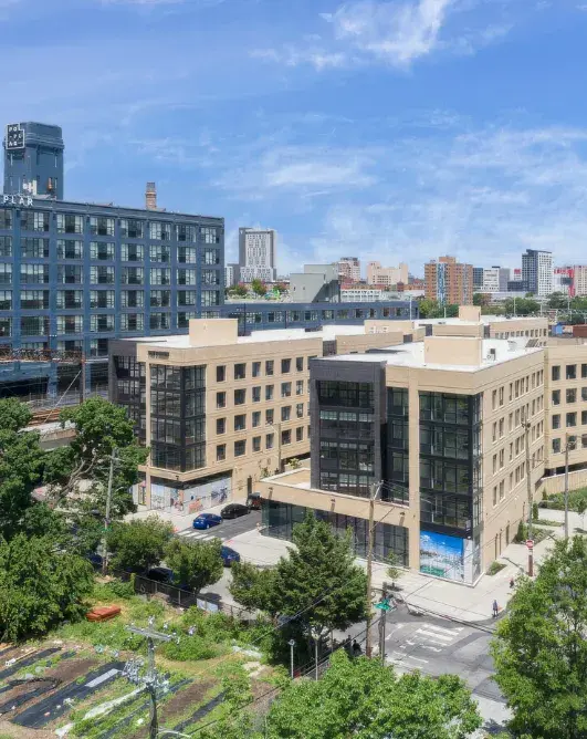 Maybe it looks like a play of light between buildings. Maybe it's the rhythmic repetition of facades that breathe with the sky.
